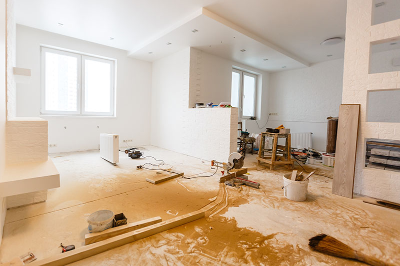 Interior of a white apartment clearly under renovation.